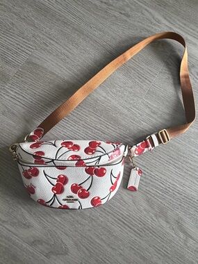Coach (Bethany Belt Bag) White Leather Crossbody Belt Bag with Red Cherry Print